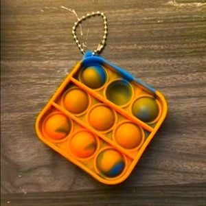 Black and orange Pop it